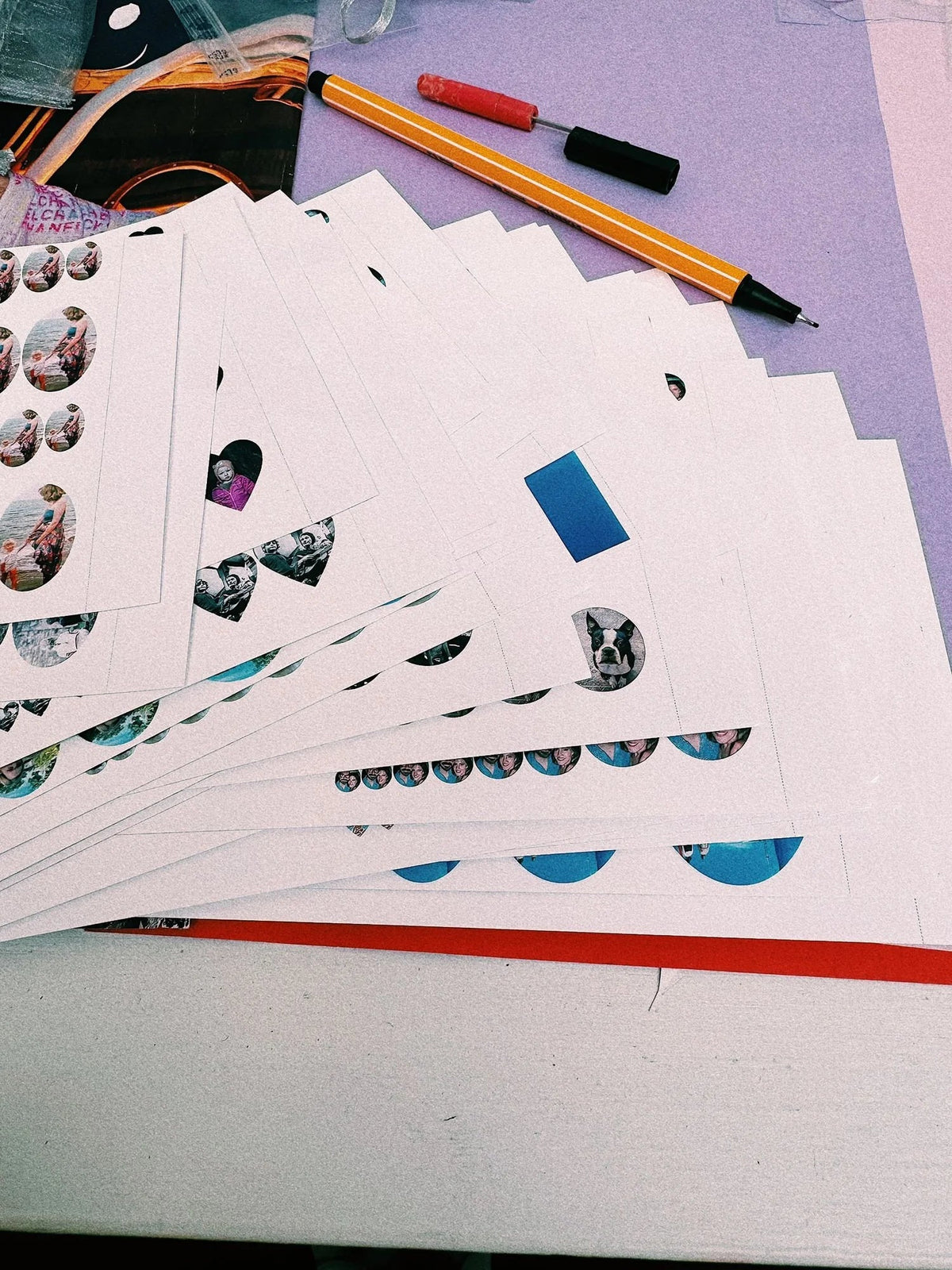 Stacks of Featherlings miniature photograph sheets ready for vintage lockets