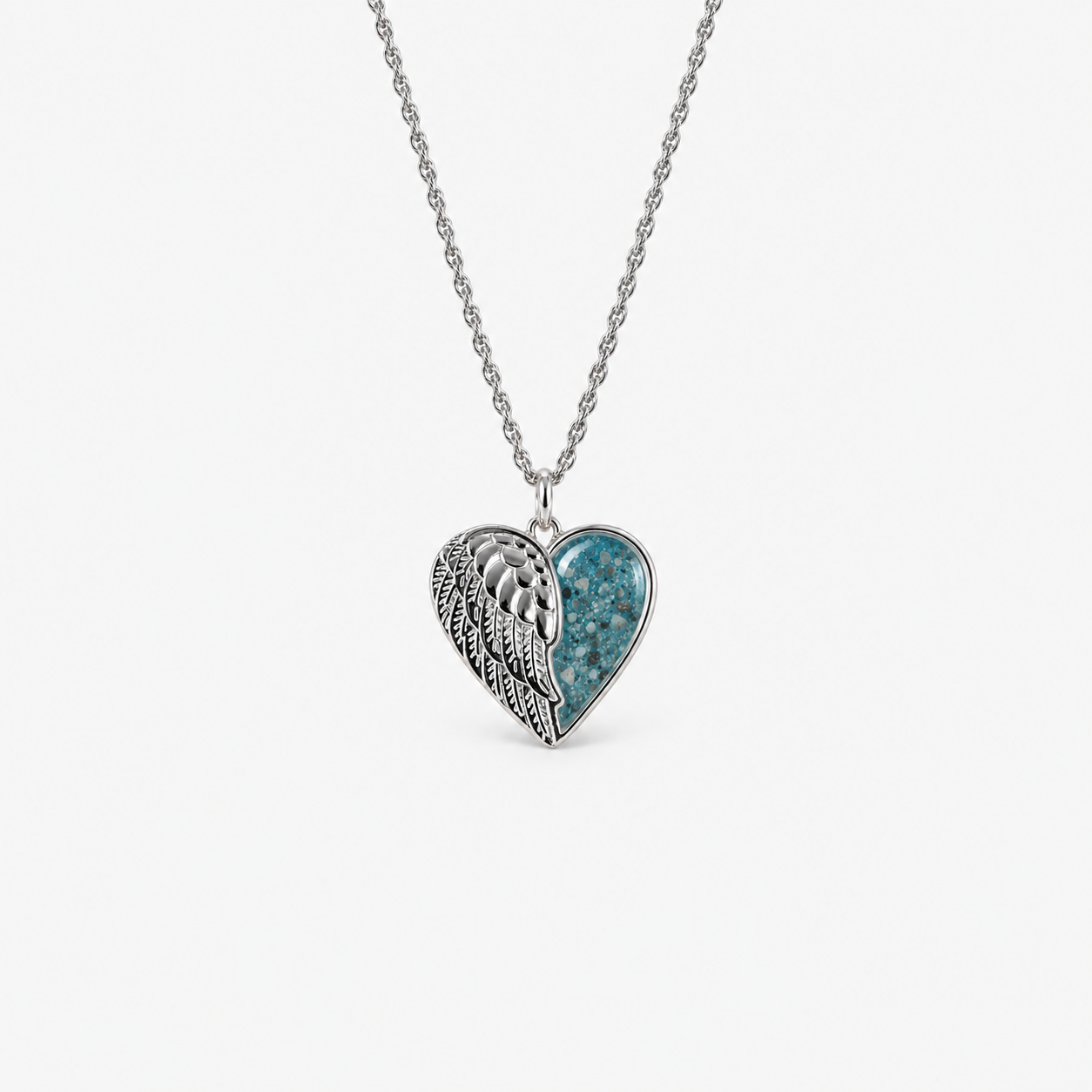 Angel Wing Heart Ashes Necklace — Sky Blue, visible ashes