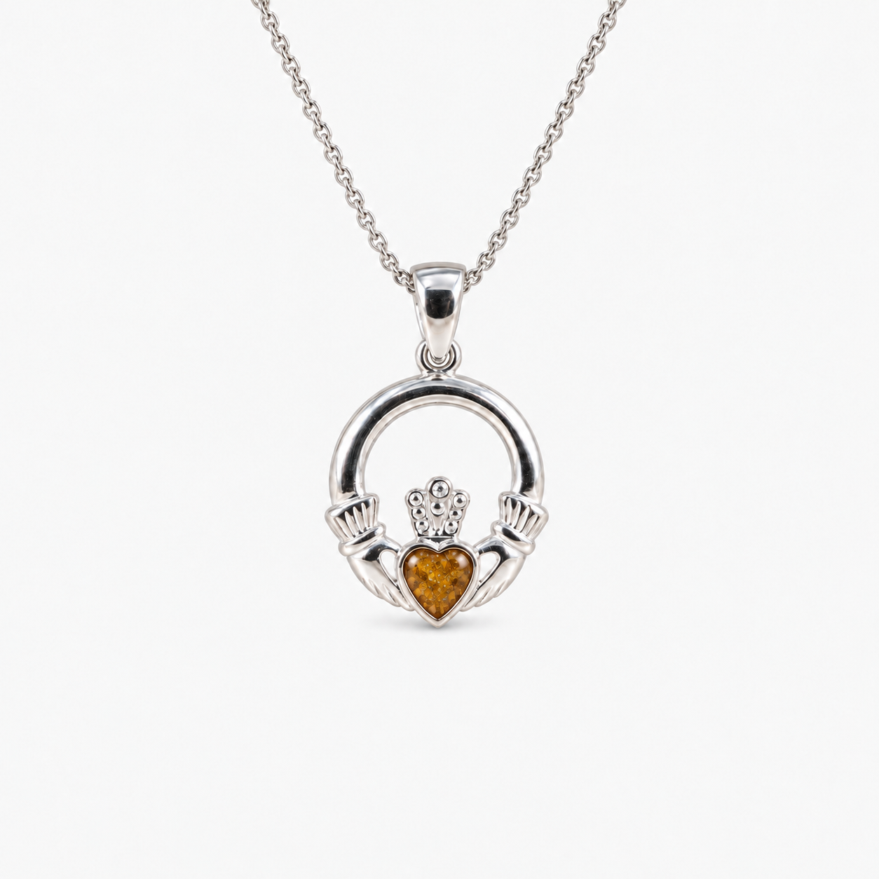 Claddagh Ashes Necklace in Amber with visible inclusions