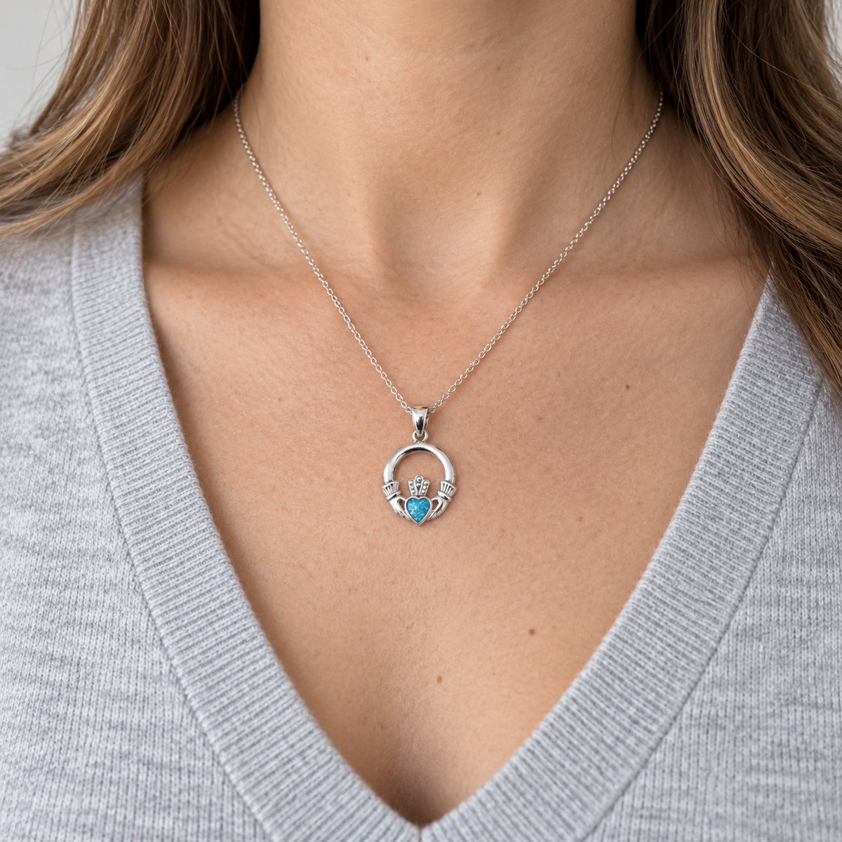 Claddagh Ashes Necklace worn, illustrative Sky Blue finish