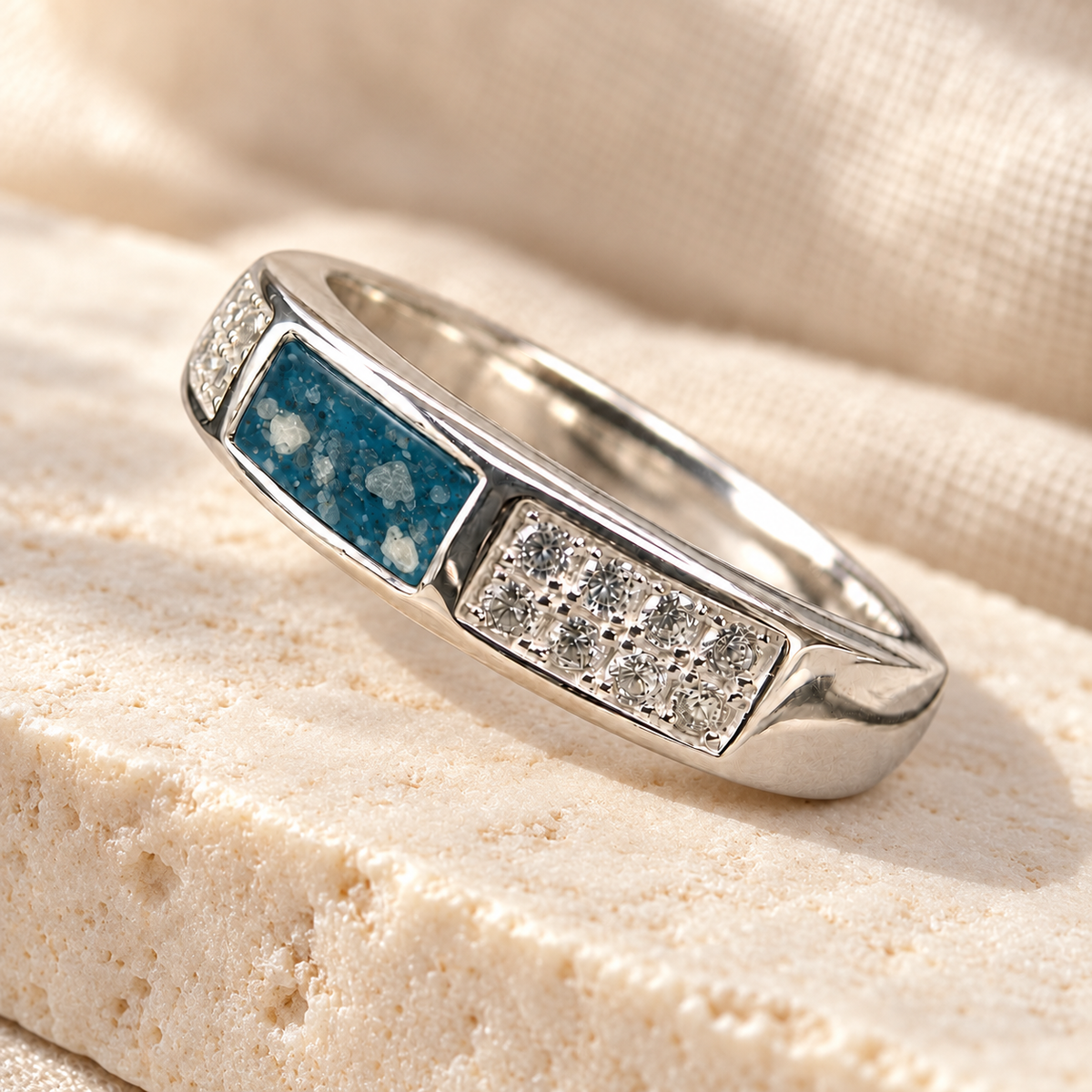 Illustrative lifestyle view of Crystal Channel Ashes Ring in Sky Blue, visible ashes