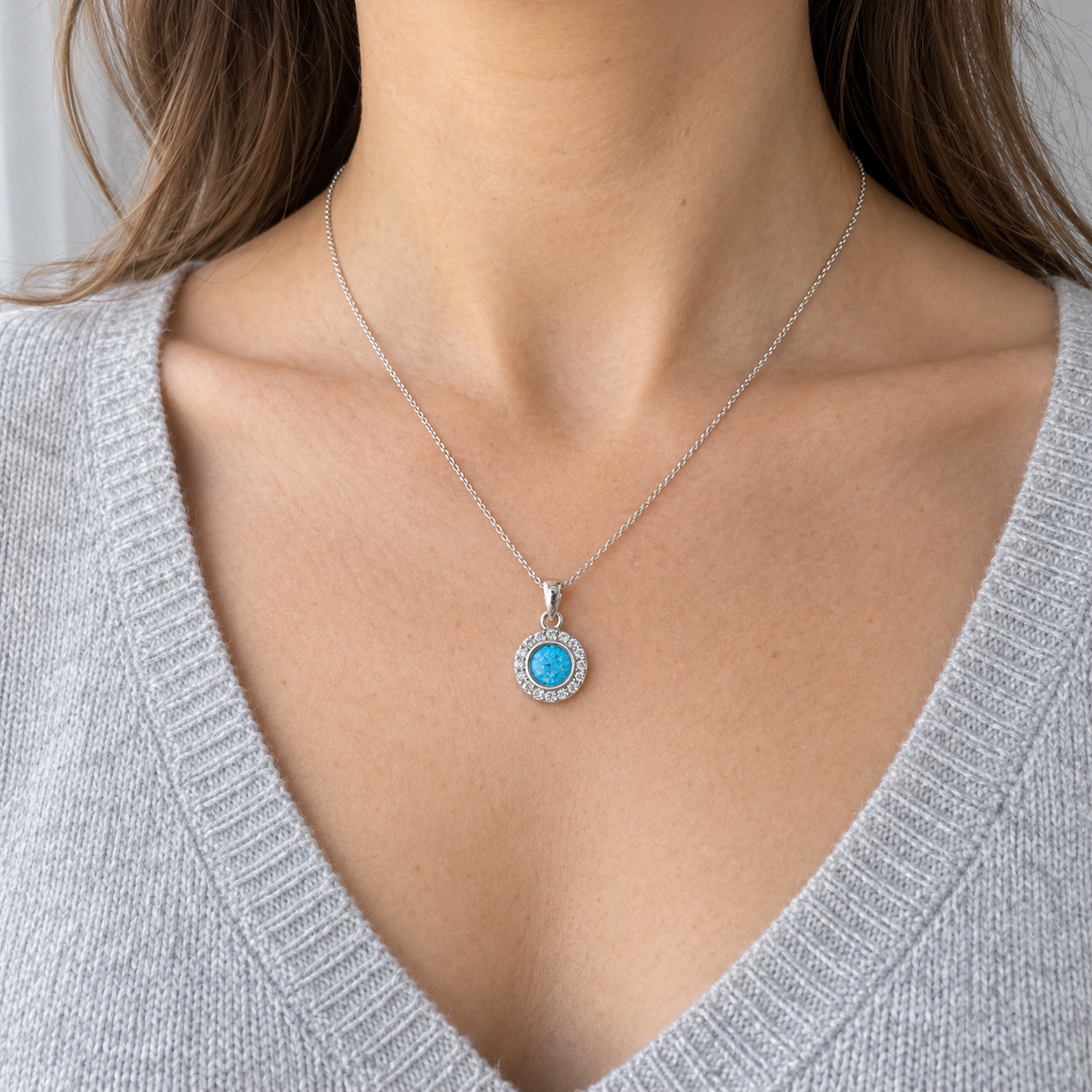 Dainty Halo Ashes Necklace worn, illustrative Sky Blue finish