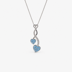 Entwined Hearts Ashes Necklace — Sky Blue, visible ashes