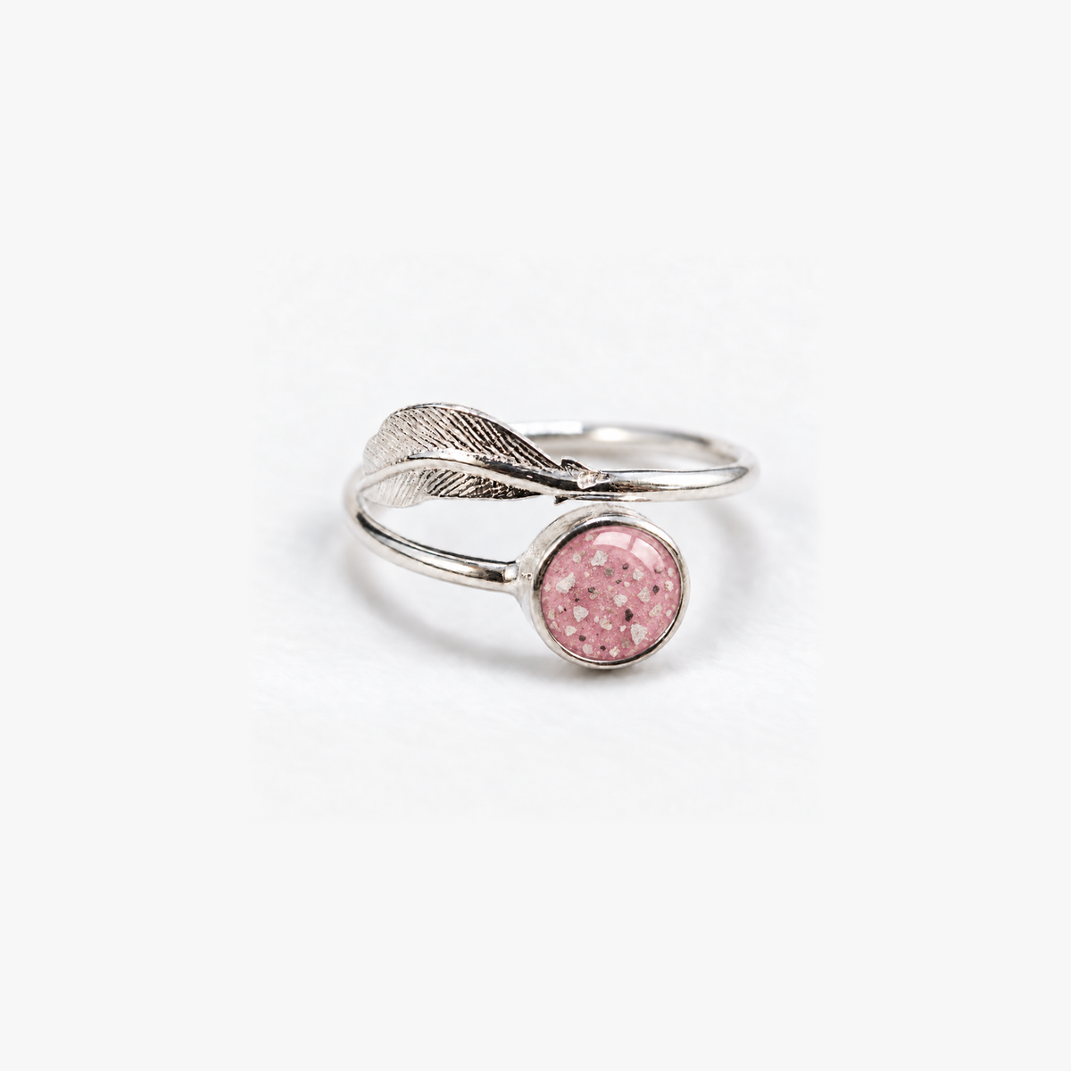 Feather Ashes Ring in Pink with visible ashes