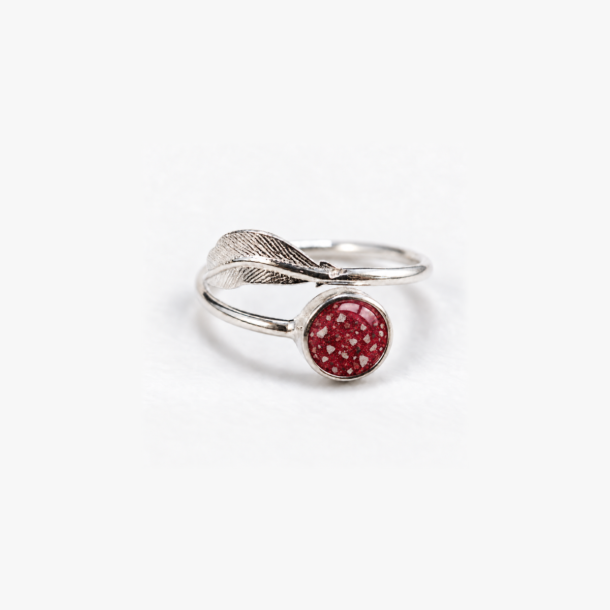 Feather Ashes Ring in Ruby Red with visible ashes