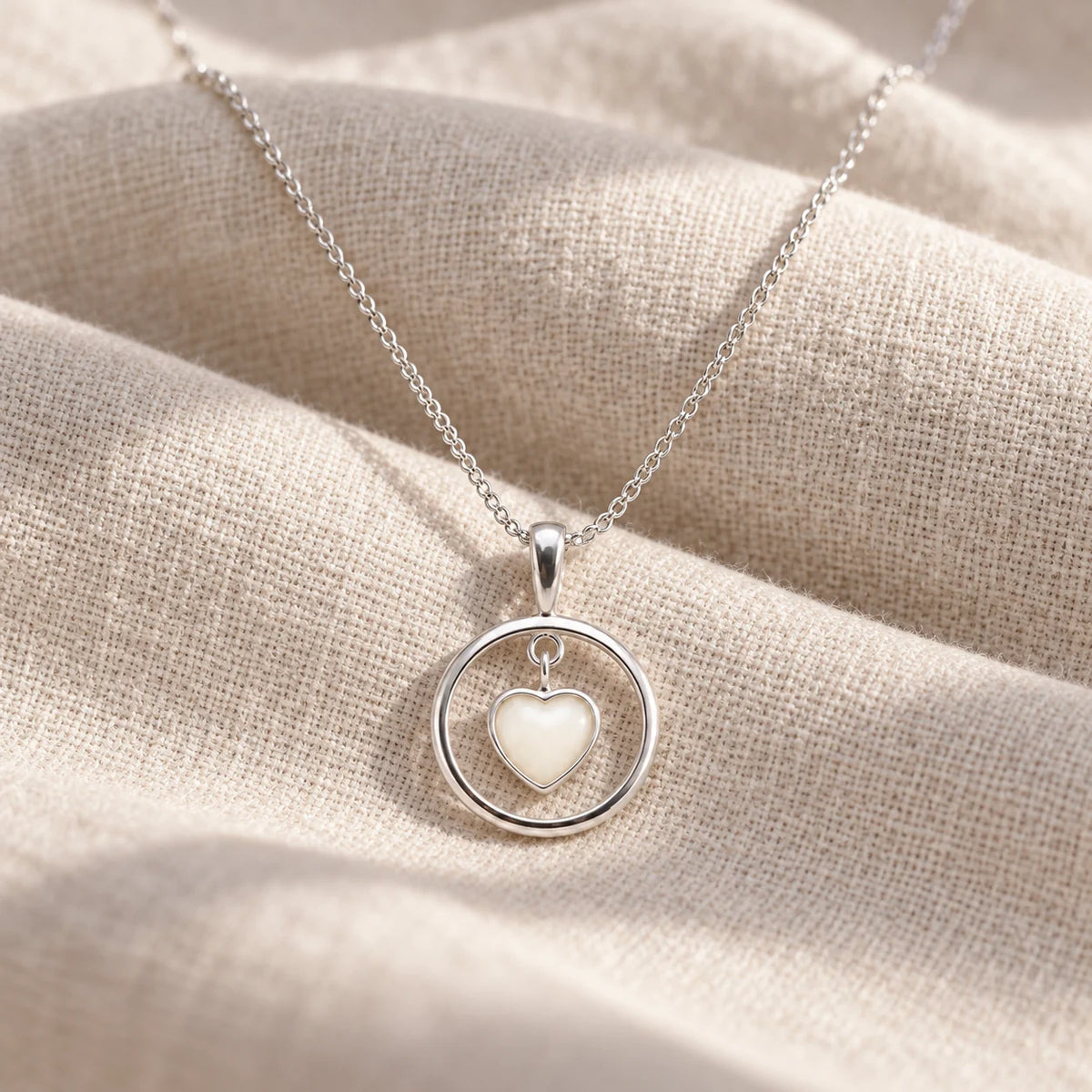 Floating Heart Breast Milk Necklace on pale linen — illustrative preview