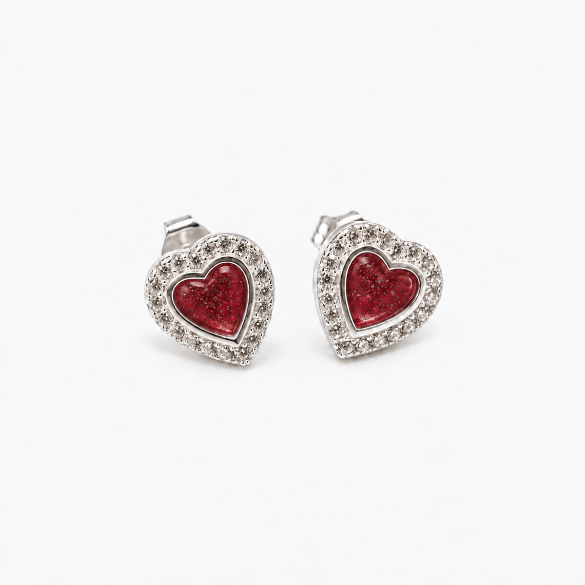 Heart Halo Ashes Earrings — Ruby Red, visible ashes