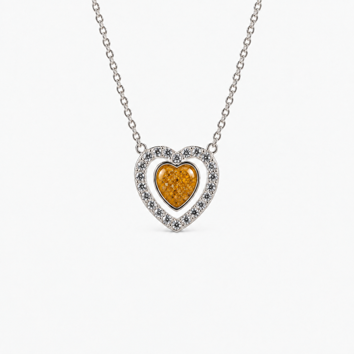 Heart Halo Ashes Necklace in Amber with visible inclusions