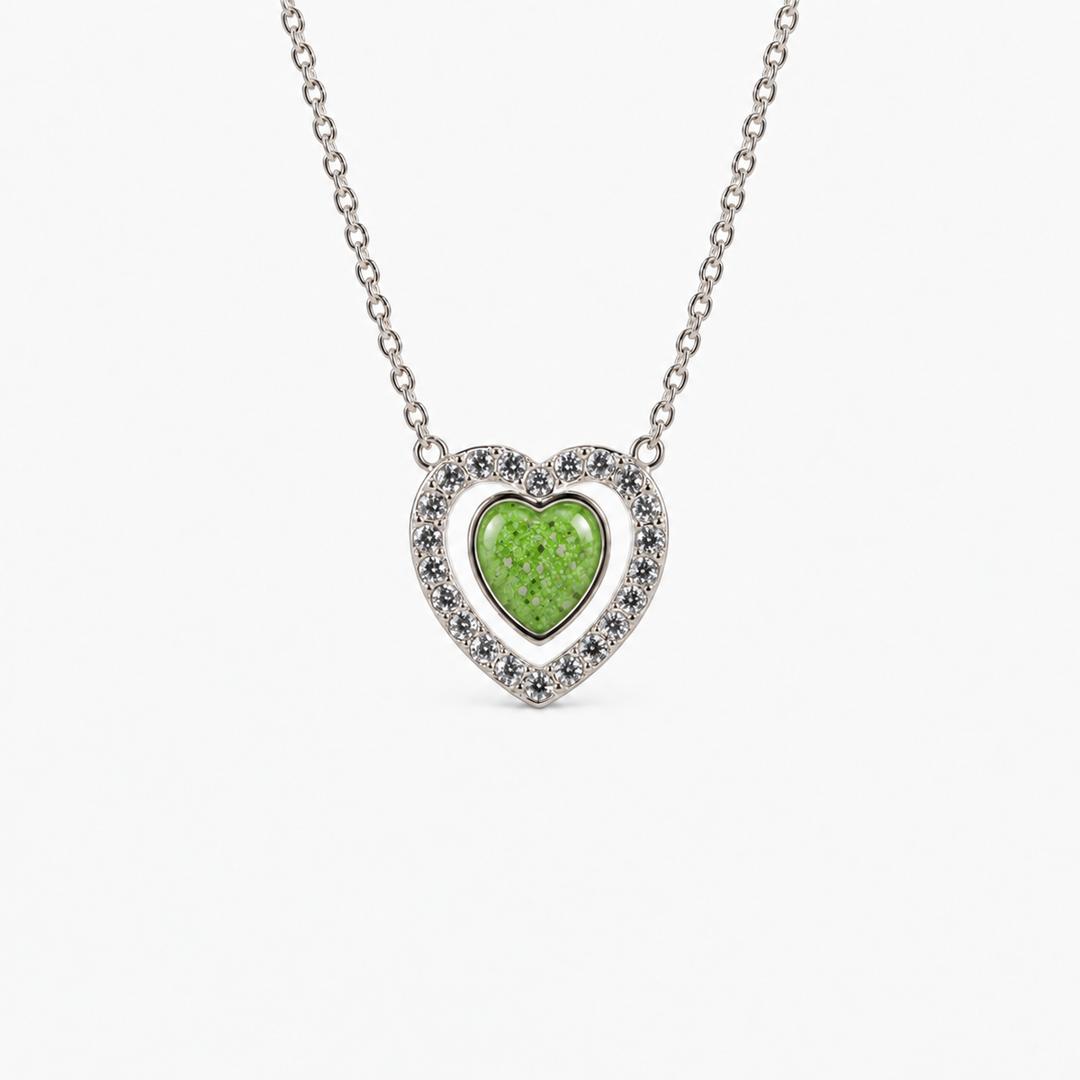 Heart Halo Ashes Necklace in Apple Green with visible inclusions