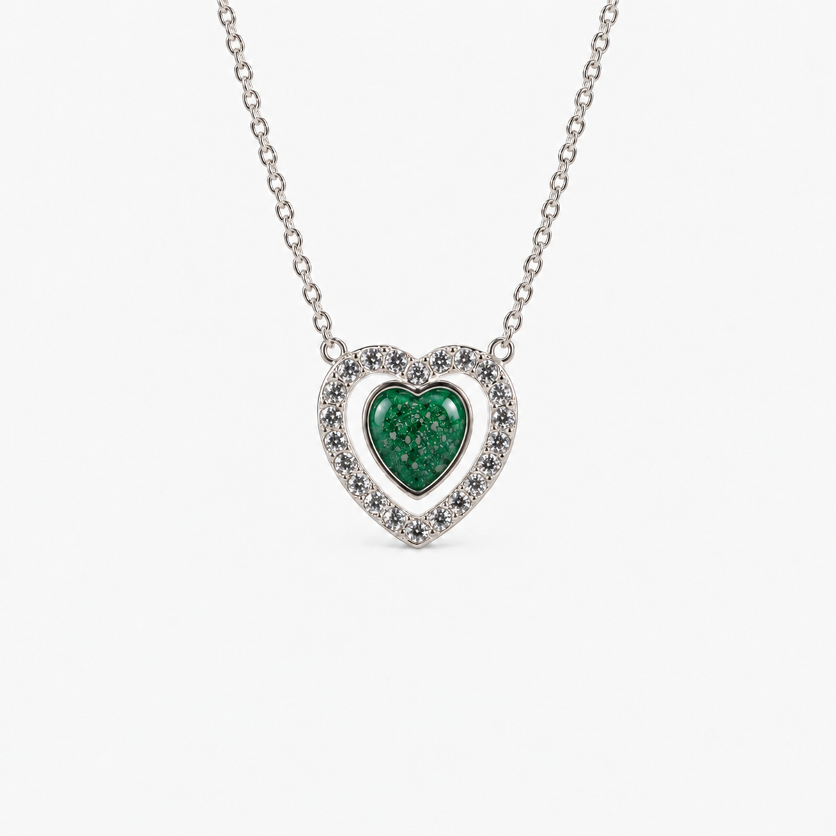 Heart Halo Ashes Necklace in Emerald with visible inclusions