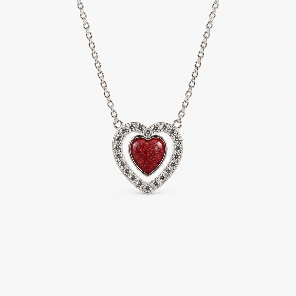 Heart Halo Ashes Necklace in Ruby Red with visible inclusions