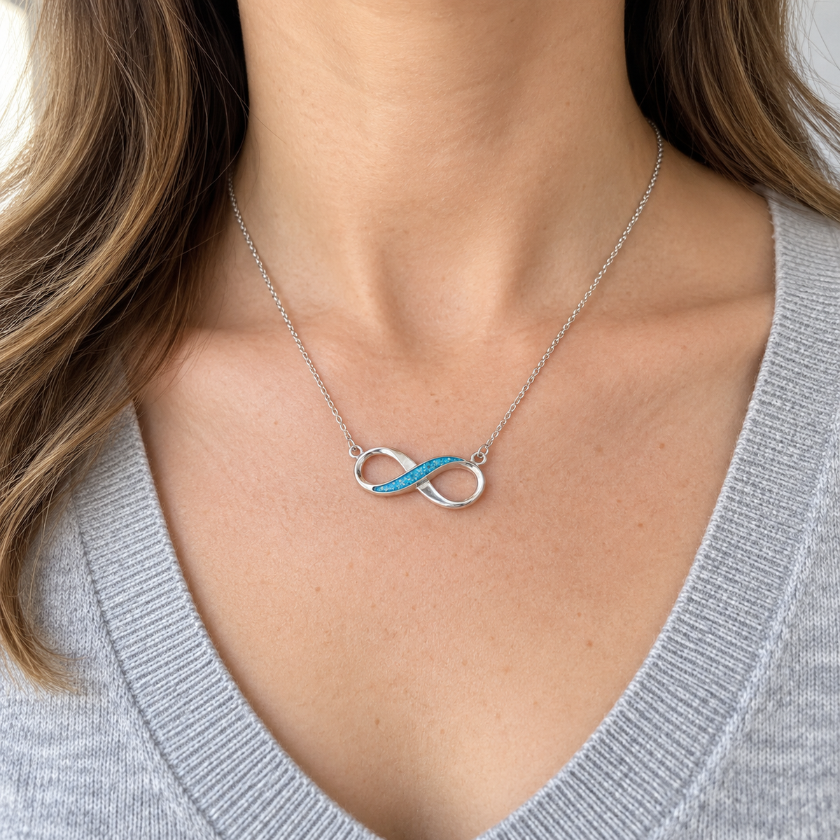 Infinity Ashes Necklace worn, illustrative Sky Blue finish