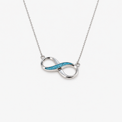 Infinity Ashes Necklace in Sky Blue with visible ashes