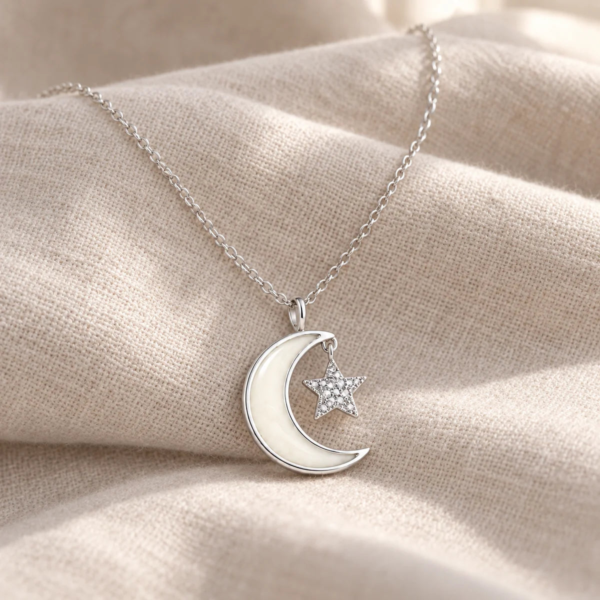 Moon and Star Breast Milk Necklace on pale linen — illustrative preview