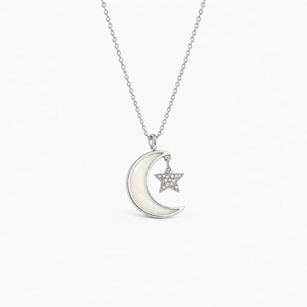 Moon and Star Breast Milk Necklace in sterling silver with natural milk resin — illustrative preview