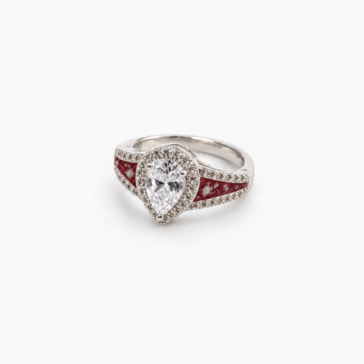 Pear CZ Ashes Ring in Ruby Red with visible ashes