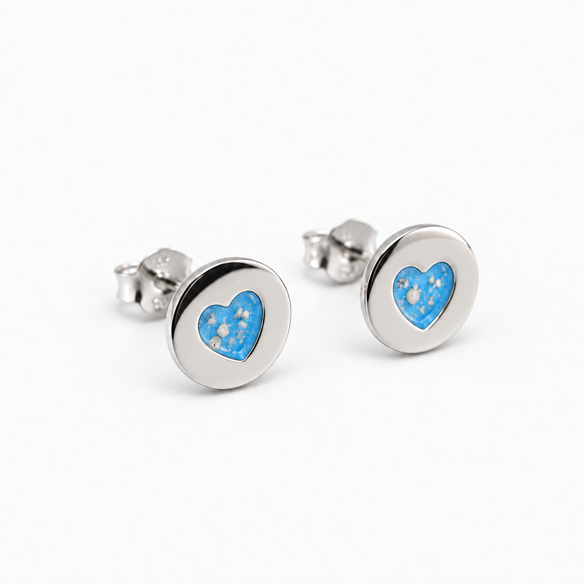 Tiny Heart Disc Ashes Earrings — Sky Blue, visible ashes