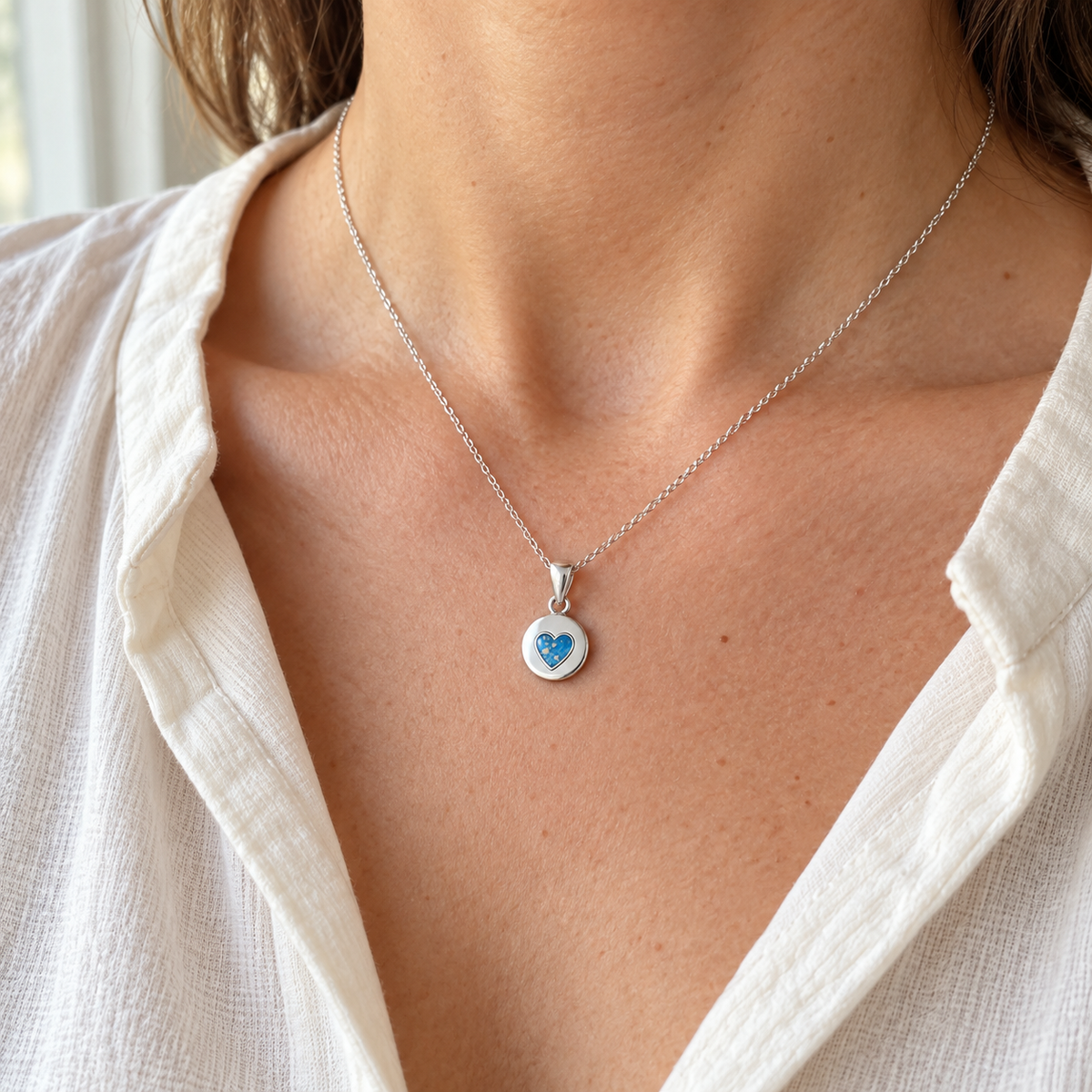 tiny heart disc ashes necklace — worn photograph