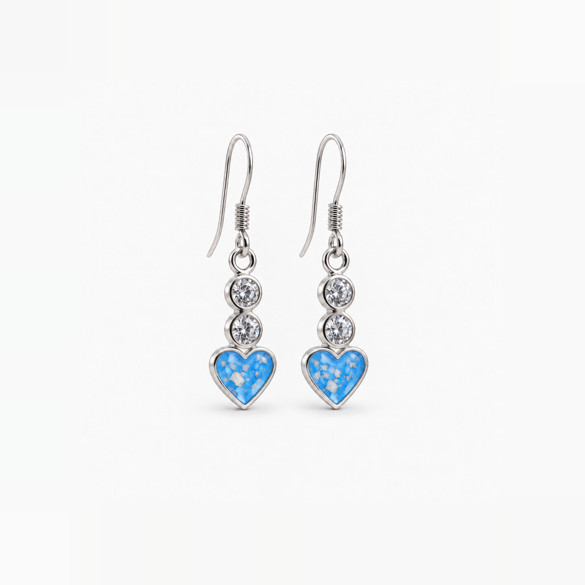 Twin Crystal Heart Drop Ashes Earrings — Sky Blue, visible ashes