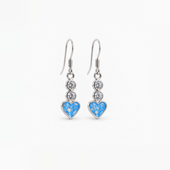 Twin Crystal Heart Drop Ashes Earrings — Sky Blue, visible ashes