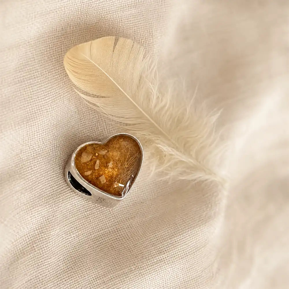 A memorial charm for Bird, a much-loved chicken