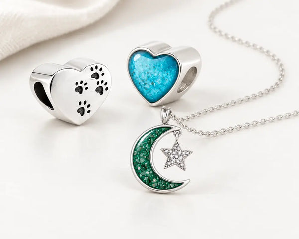Paw-print heart ashes charm and emerald Moon and Star memorial necklace