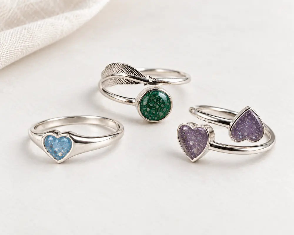 Three sterling silver ashes rings in sky blue, emerald and purple