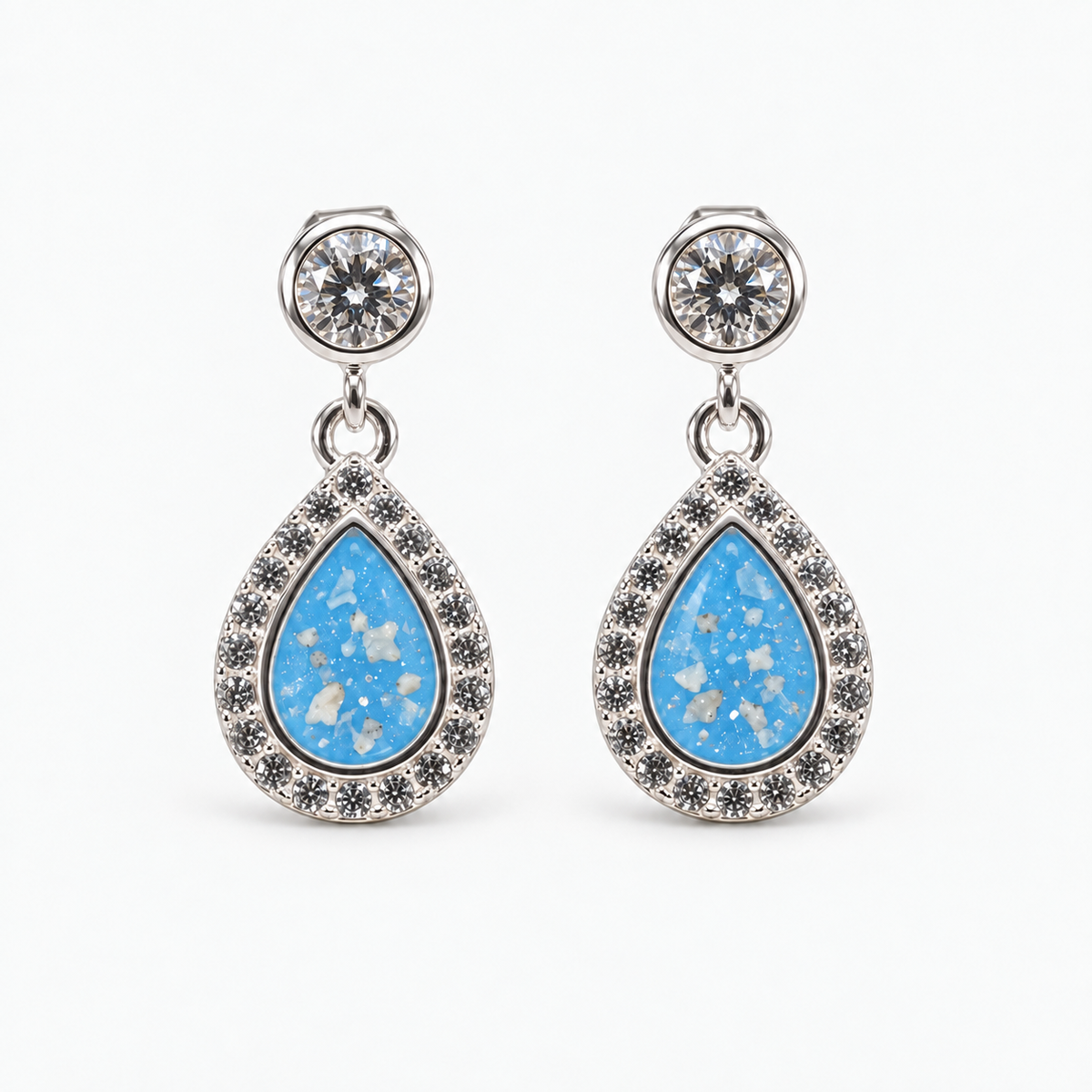 Crystal Halo Teardrop Ashes Earrings — Sky Blue, visible ashes