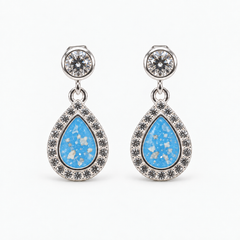 Crystal Halo Teardrop Ashes Earrings — Sky Blue, visible ashes