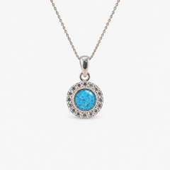 Dainty Halo Ashes Necklace in Sky Blue with visible ashes