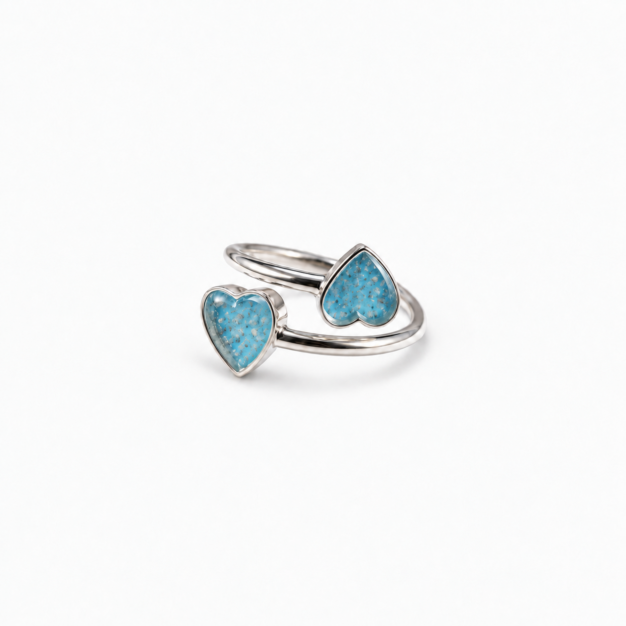 Double Heart Ashes Ring in Sky Blue with visible ashes
