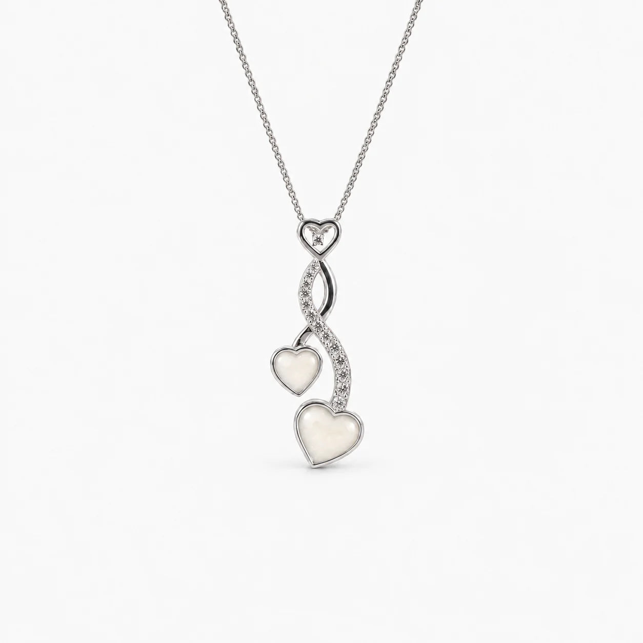 Entwined Hearts Breast Milk Necklace in sterling silver with natural milk resin — illustrative preview