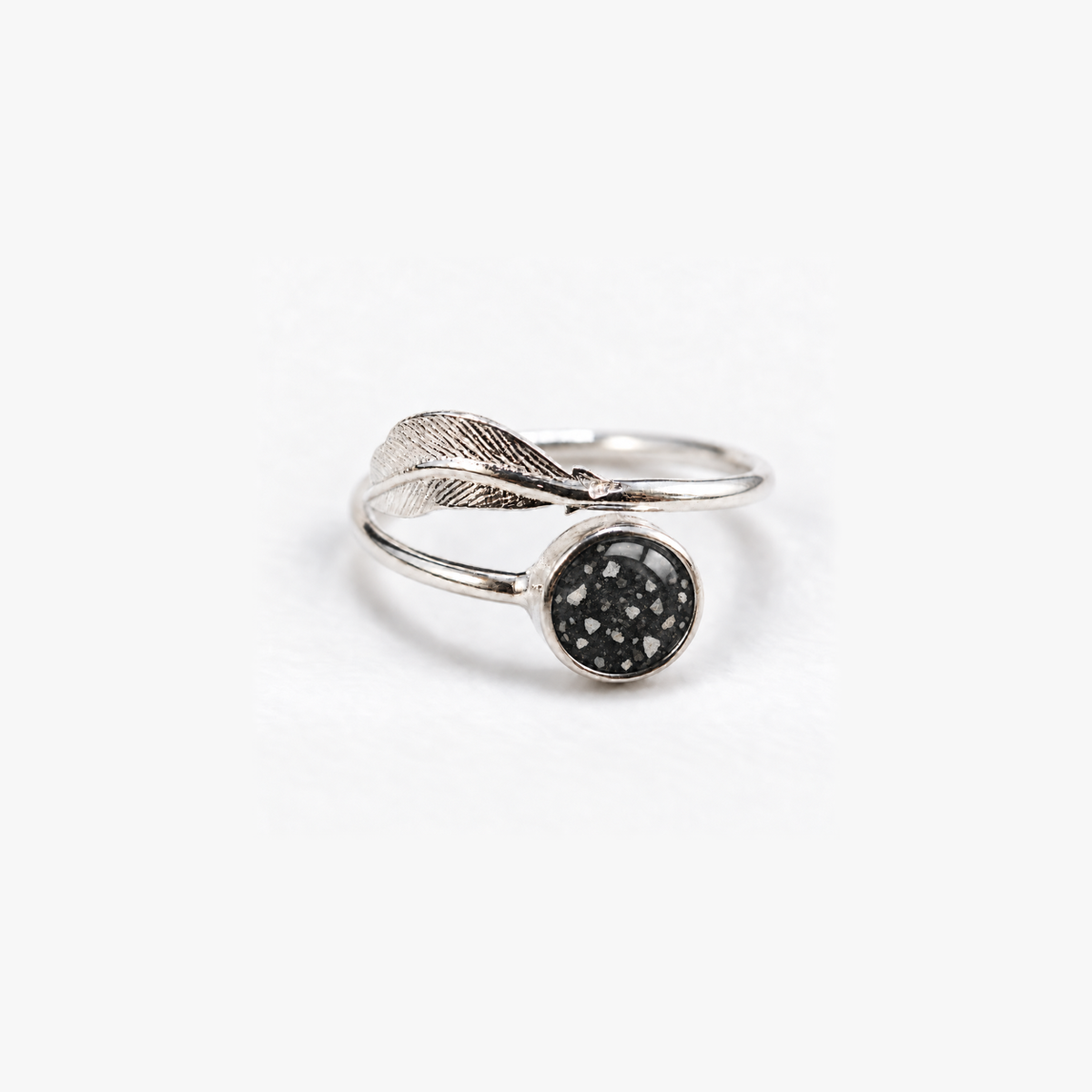 Feather Ashes Ring in Midnight with visible ashes