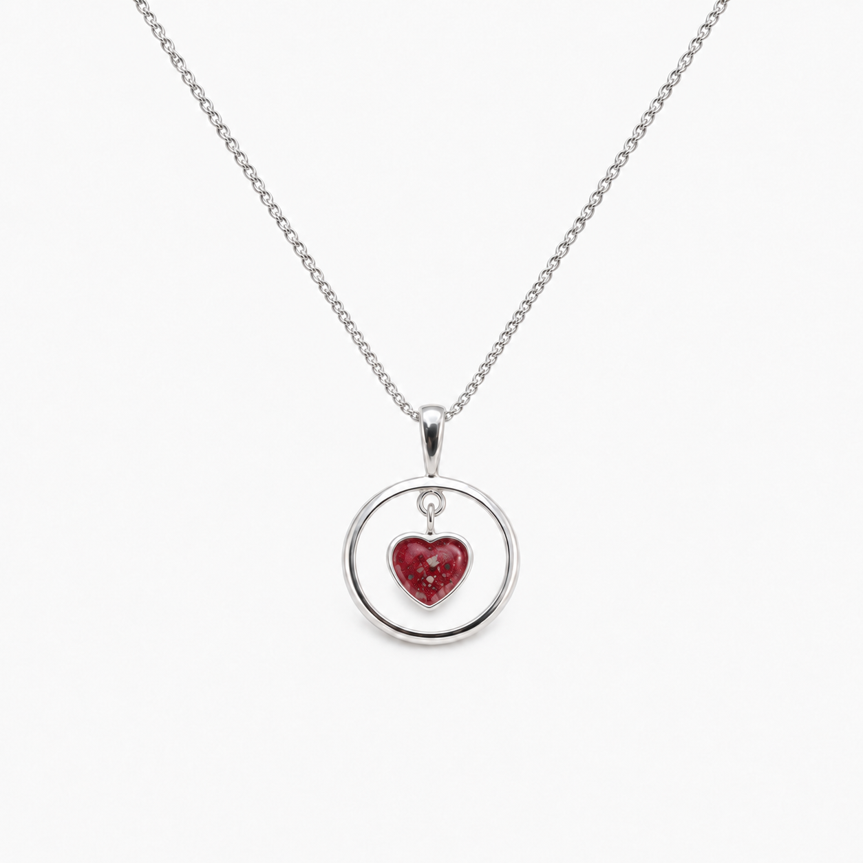 Floating Heart Ashes Necklace — Ruby Red, visible ashes