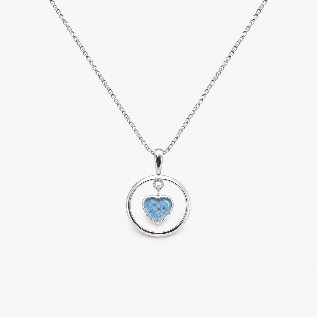 Floating Heart Ashes Necklace in Sky Blue with visible inclusions