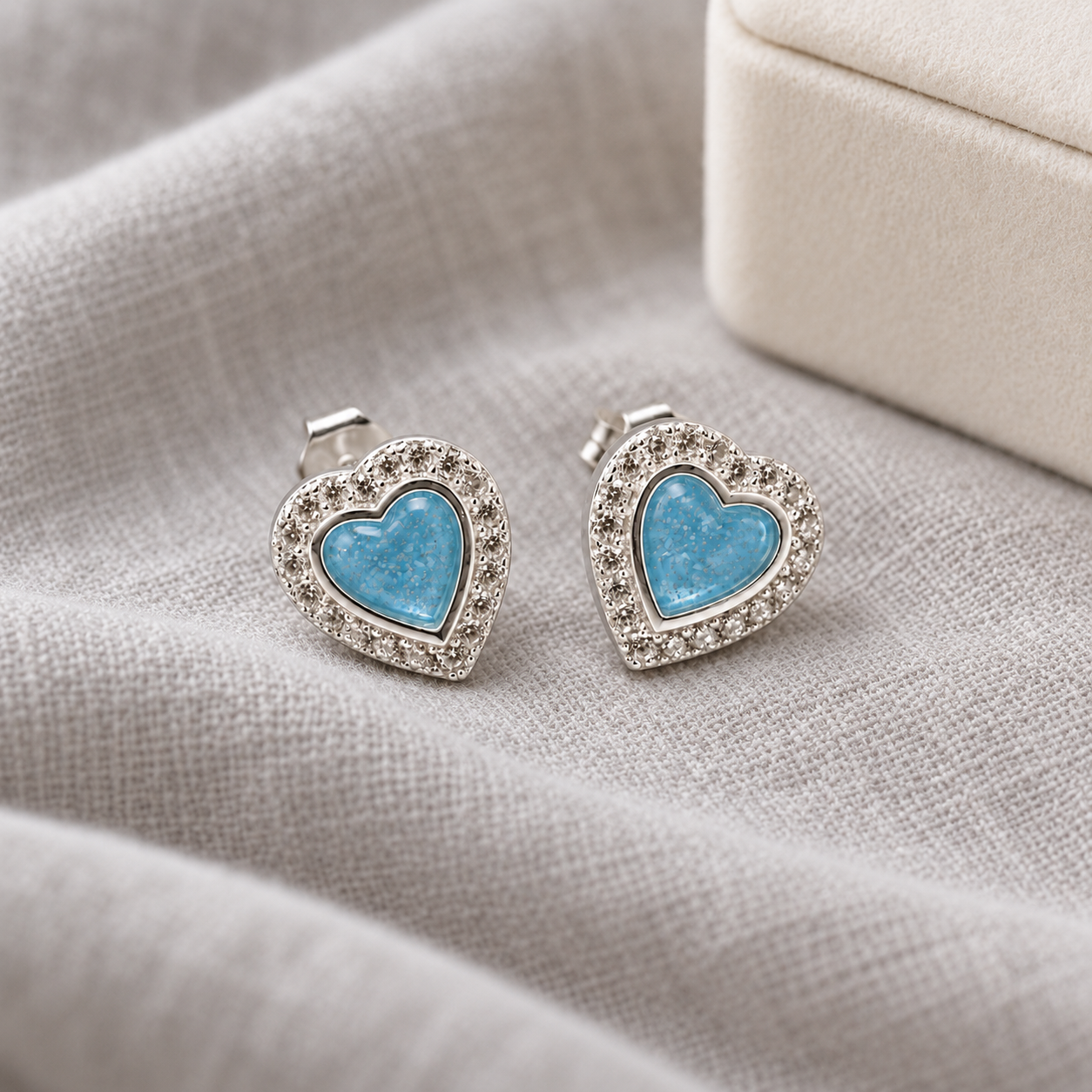 heart halo ashes earrings in Sky Blue, shown at natural scale
