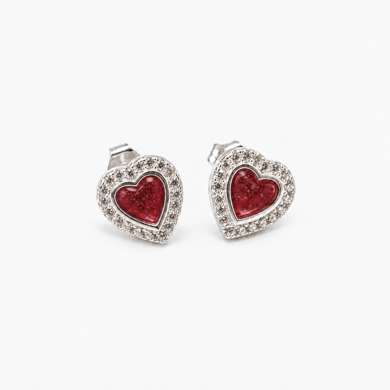 Heart Halo Ashes Earrings — Ruby Red, visible ashes