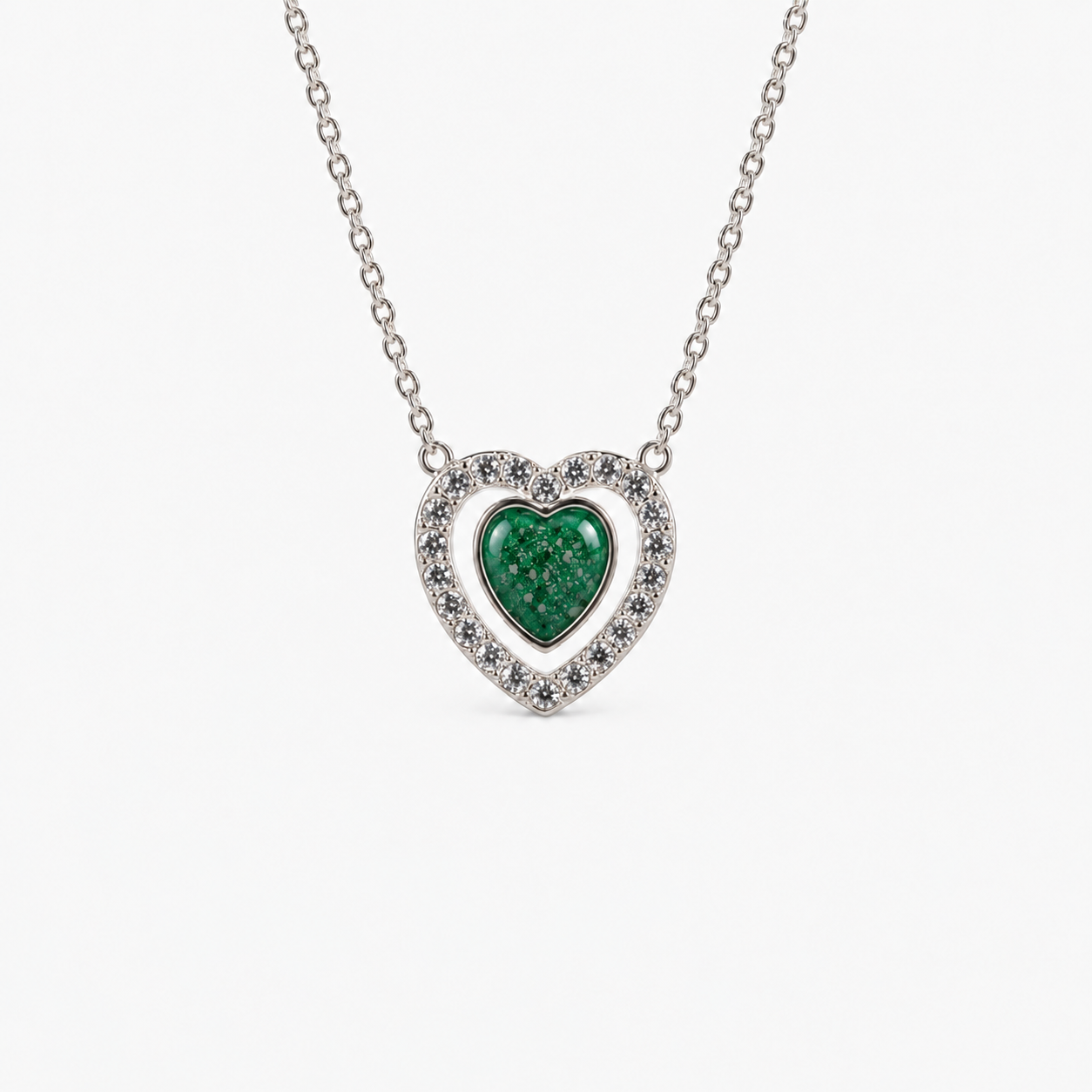 Heart Halo Ashes Necklace in Emerald with visible inclusions