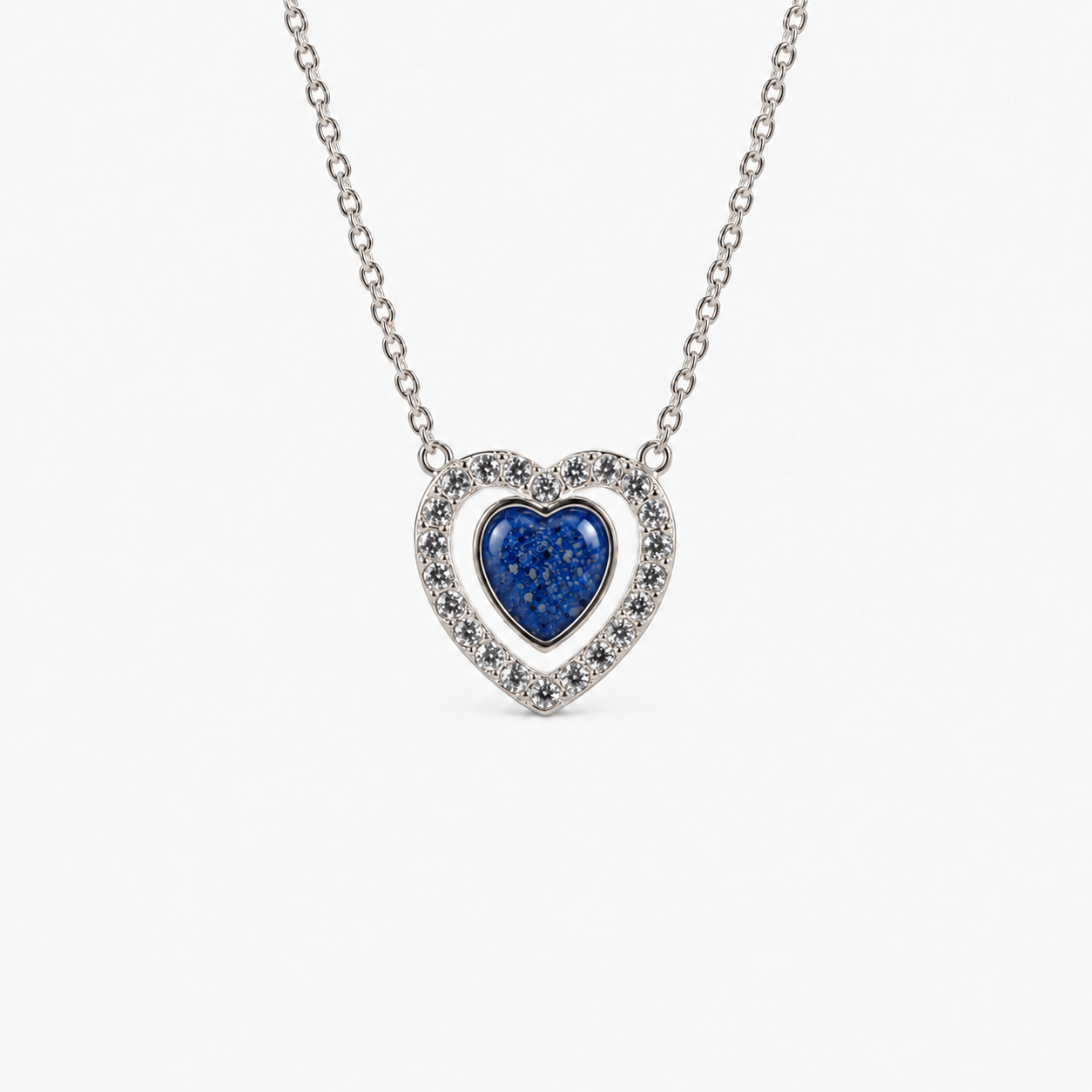 Heart Halo Ashes Necklace in Sapphire with visible inclusions