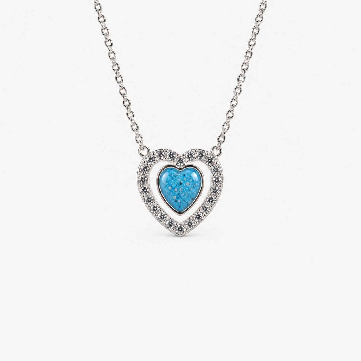 Heart Halo Ashes Necklace in Sky Blue with visible ashes
