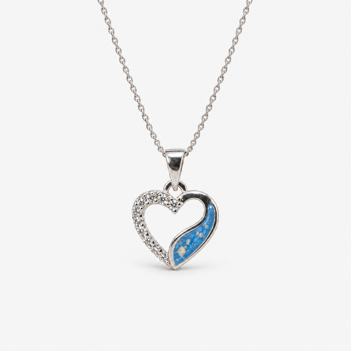Crystal Sweep Heart Ashes Necklace in Sky Blue with visible ashes