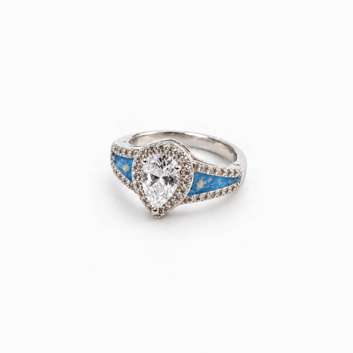 Pear CZ Ashes Ring in Sky Blue with visible ashes