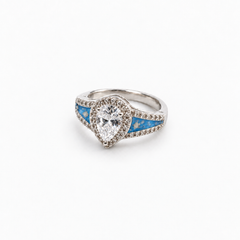 Pear CZ Ashes Ring in Sky Blue with visible ashes