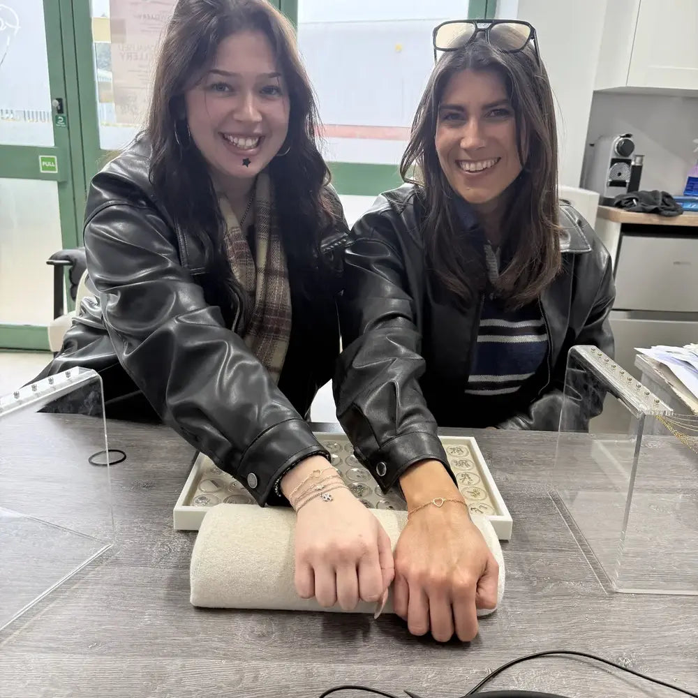 Friends wearing permanent bracelets at Featherlings in Portsmouth