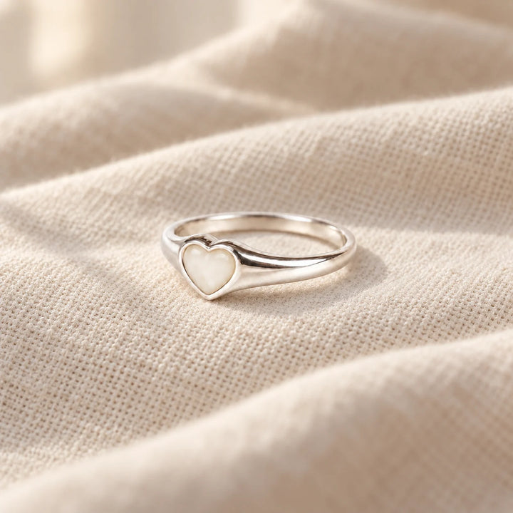 Petite Heart Breast Milk Ring on pale linen — illustrative preview