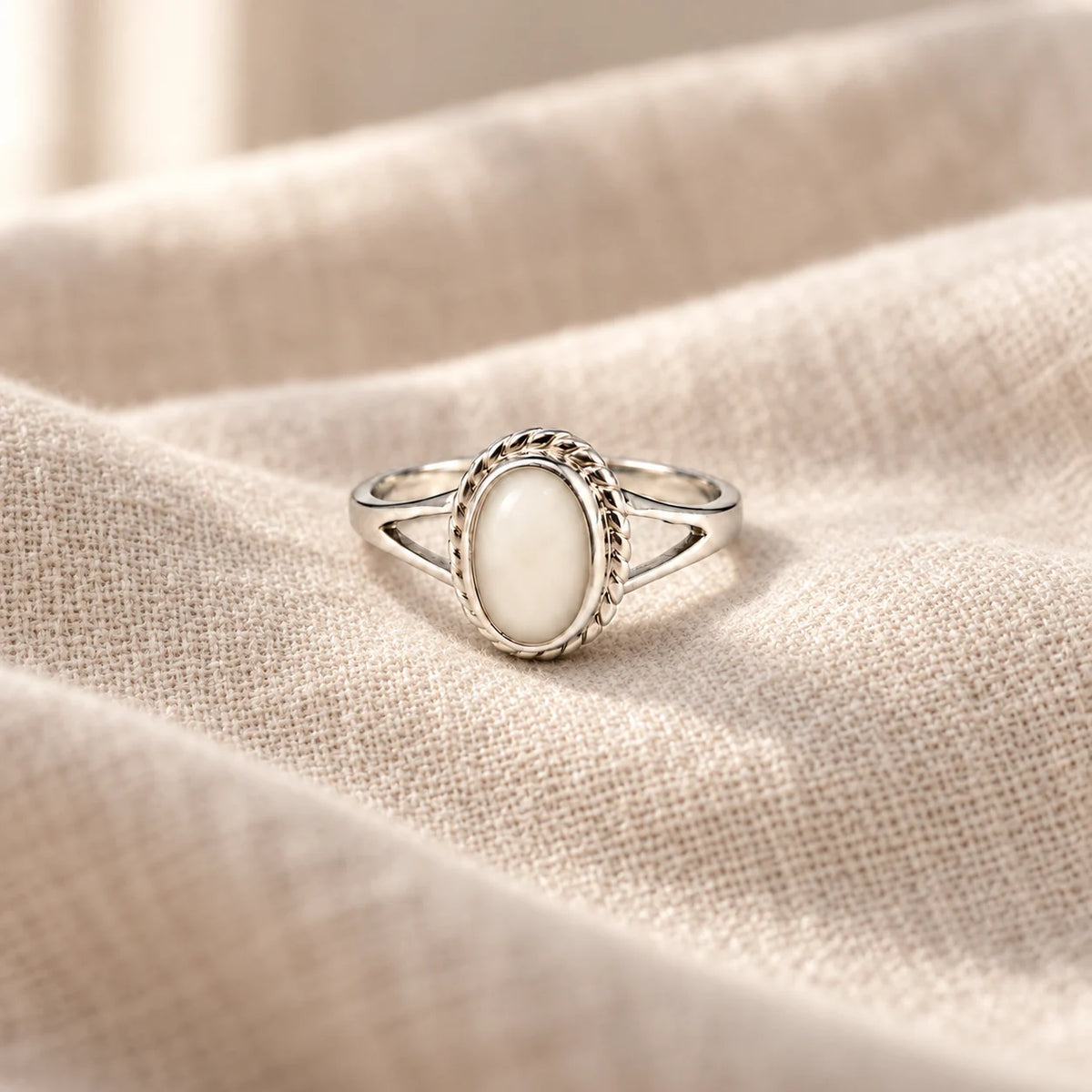 Rope Oval Breast Milk Ring on pale linen — illustrative milk jewellery preview