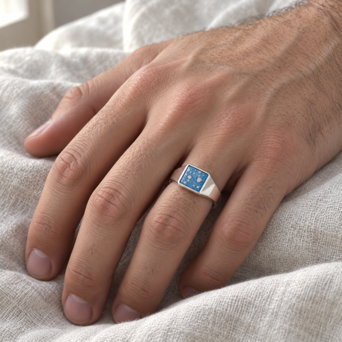 small square signet ashes ring — worn photograph