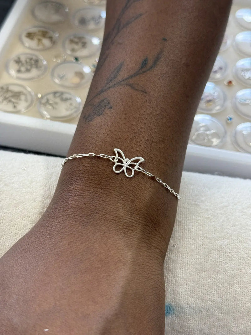 Sterling silver permanent bracelet with butterfly connector