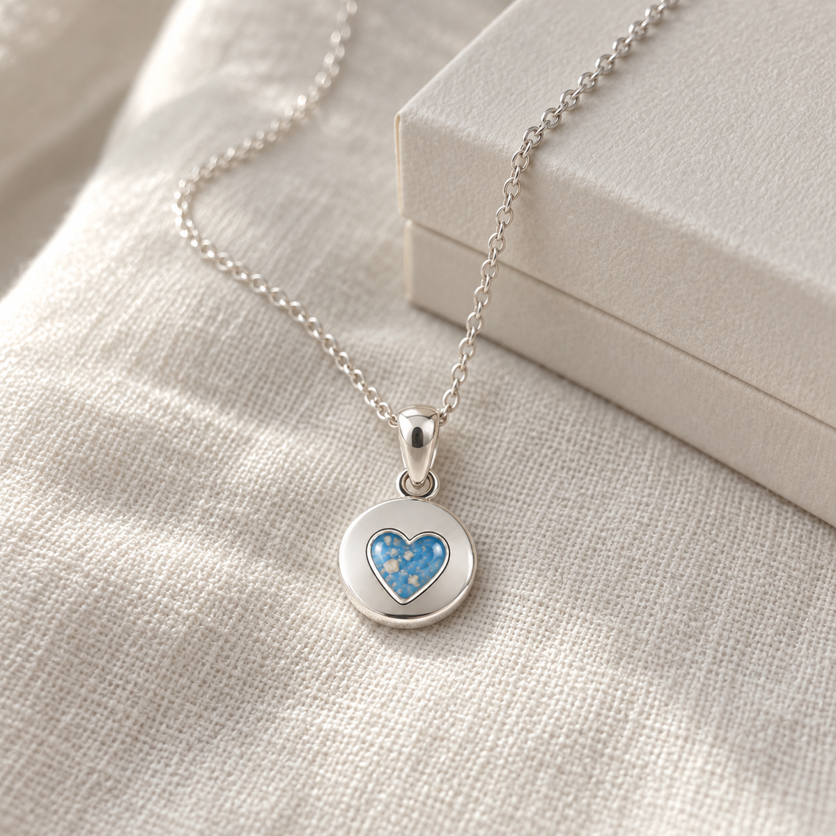 tiny heart disc ashes necklace — lifestyle photograph