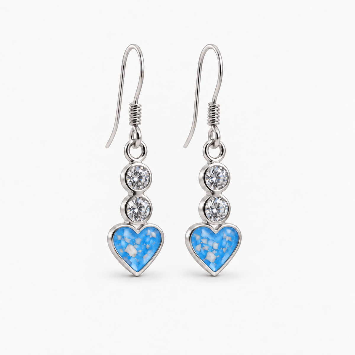 Twin Crystal Heart Drop Ashes Earrings — Sky Blue, visible ashes